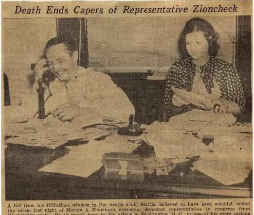 Newspaper photograph of Marion Zioncheck seated at a desk with a woman standing beside him